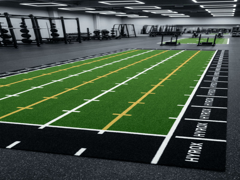 gym owner inspecting turf maintenance